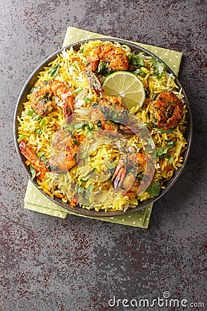 Meygoo Polo pilaf Rice with herbs and prawns closeup on the plate. Vertical top view Stock Photo