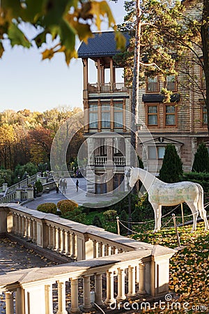 Mezhyhirya, Ukraine - 07 November 2020: Sculpture of a horse against the background of the residence of the former President of Uk Editorial Stock Photo