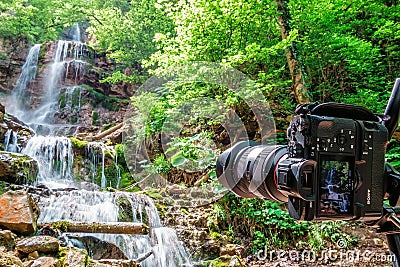 Waterfall cascade shooting with Sony A7RII placed on tripod in Caucasus Mountains by Mezmay village Editorial Stock Photo