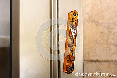 Mezuzah. Religious attribute at the entrance to a house. Decorative wooden Mezuzah at the entrance to a modern residential Stock Photo