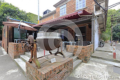 Mezzanine tiltable industrial steam pot in redtory creative garden, guangzhou, china Editorial Stock Photo