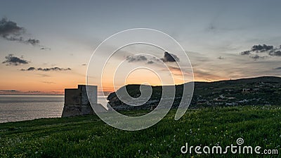 Mgarr Ix-Xini Bay Tower Gozo. Malta. Horizontal at sunset Stock Photo