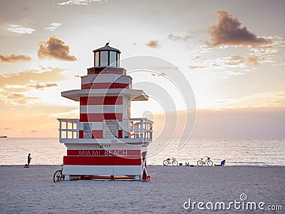 Miami Beach, Florida, august 2019. People taking it easy near a Lifeguard Tower Seagull on South beach during sunset Editorial Stock Photo