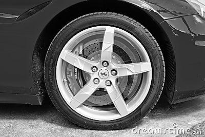 Miami Beach, Florida USA - April 15, 2021: red Ferrari wheel tire with car brand Editorial Stock Photo