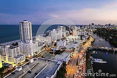 Miami Beach, Florida, USA - Evening aerial of luxury condominiums and hotels along Indian Creek Driver at Mid Beach. Editorial Stock Photo