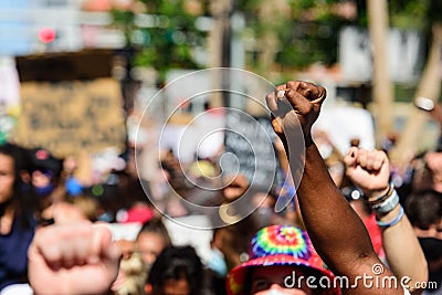 Miami Downtown, FL, USA - MAY 31, 2020: Black hand at a peaceful protest. Human rights. The situation in the USA with Editorial Stock Photo