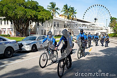 Miami Downtown, FL, USA - MAY 31, 2020: Police Bicycle Patrol in Miami. Protection for the city. Calm and safety. Editorial Stock Photo