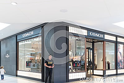 interior of Coach store. Coach, Inc. is known for accessories and gifts, including handbags, bags, small leather goods, footwear, Editorial Stock Photo