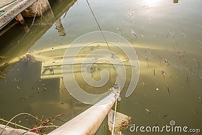 Miami, Florida - September 16, 2017: Sunken boat on Brickell Bay avenue marina days after hurricane Irma strikes the city during Editorial Stock Photo