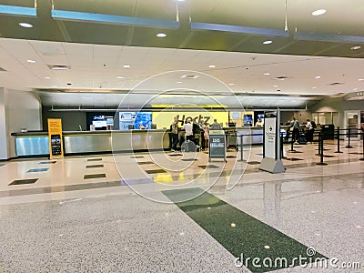 Miami, Florida, USA - November 29, 2019: The people near Hertz rental car office at Miami airport Editorial Stock Photo