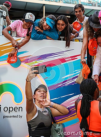 Jessica Pegula of USA takes selfie with tennis fans after winning the women's doubles final match at 2023 Miami Open Editorial Stock Photo