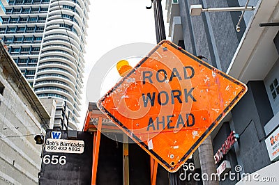 Miami, USA - October 30, 2015: construction sign on city road. Road work ahead warning and safety. Transportation traffic and trav Editorial Stock Photo