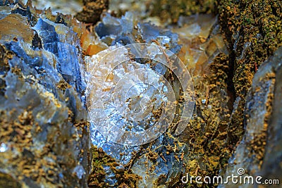 The mica sheets and quartz silicate minerals. Bare geological rock in soft sludge clay rocks. Macro lens shot. Stock Photo