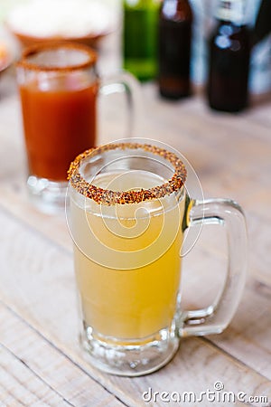 Michelada mexican cocktail beer in Mexico city in a mexican party terrace Stock Photo