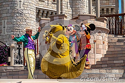 Mickey and Minnie dancing with The princess and the frog characters in Magic Kingdom 6 Editorial Stock Photo