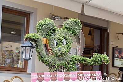 Mickey Mouse head shaped tree. Tree trimming Editorial Stock Photo