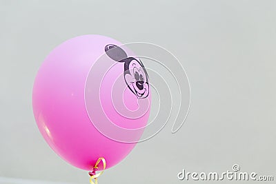 Mickey Mouse party. Character of Walt Disney cartoon on pink balloon Editorial Stock Photo