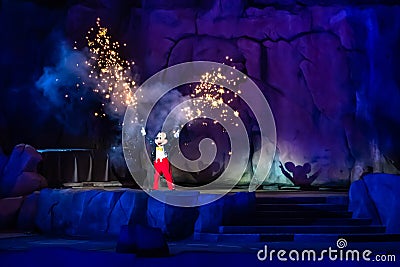 Mickey Mouse throwing fireworks from his hands in Fantasmic Show at Hollywood Studios 145. Editorial Stock Photo
