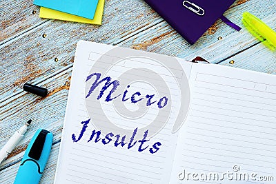 Micro Insults sign on the page Stock Photo