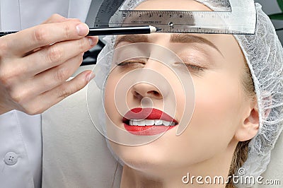 Microblading. Permanent makeup. Attractive woman getting facial care and tattoo Stock Photo