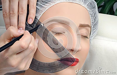 Microblading. Permanent makeup. Attractive woman getting facial care and tattoo Stock Photo