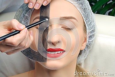Microblading. Permanent makeup. Attractive woman getting facial care and tattoo Stock Photo