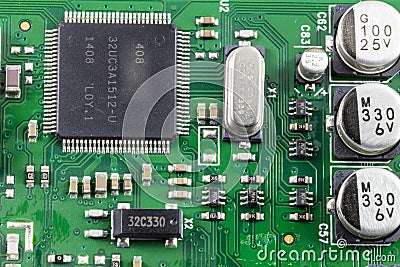 Microchip electronic green circuit board solder connections Stock Photo