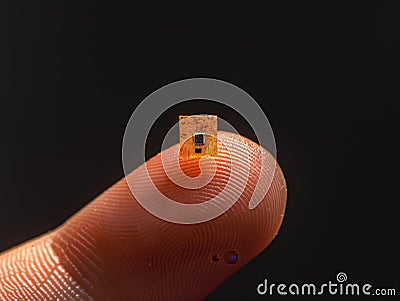 Microchip on Fingertip Innovation Concept Stock Photo