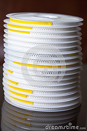 Microelectronics Concepts. Stack of SMD or Surface Mount Components On Tape and Reel Holders in One Batch Together Stock Photo