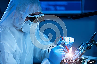 Microelectronics engineer works in a modern scientific laboratory on computing systems and microprocessors. Electronic Stock Photo
