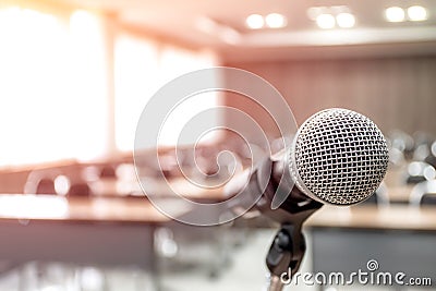 Microphone on abstract blurred of speech in seminar room Stock Photo