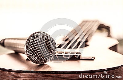 Microphone on acoustic guitar Stock Photo