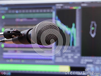 Microphone on the background of the computer monitor. Home recording Studio. Close-up. The focus in the foreground Stock Photo