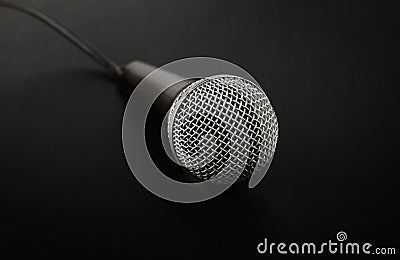 Microphone with cable high angle close up over black Stock Photo