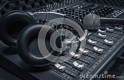Microphone, headphone, sound mixer background. Stock Photo