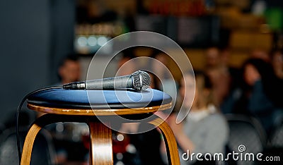 microphone lies on a chair on the stage before the performance Stock Photo