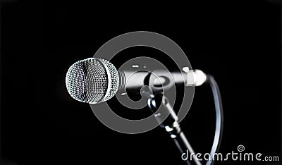 Microphone, mic, karaoke, concert, voice music. Closeup microphone. Vocal audio mic on a bleck background. Live music Stock Photo