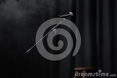 microphone near curtain and wooden chair Stock Photo