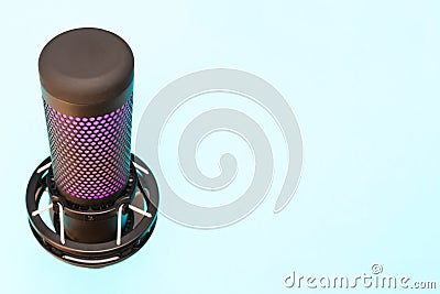 Microphone with place for text on a blue background. Copy space. Modern, black microphone with spider. Concept for Stock Photo