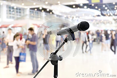 Microphone public relations on Blurred many People within Department store Shopping Mall Event hall inside background Stock Photo