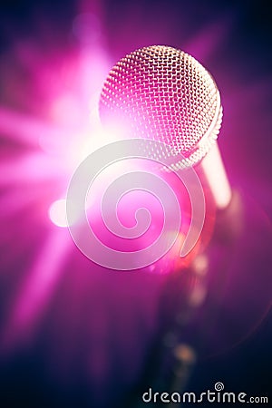 Microphone on stage with shiny glare Stock Photo