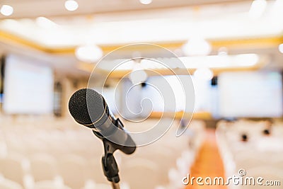 Microphone stand in conference hall blurred background with copy space. Public announcement event, Organization company meeting Stock Photo