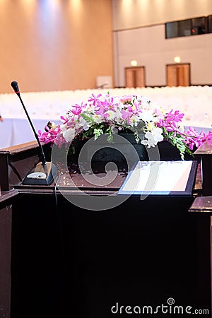 Microphone on stand podium decoration with flower Stock Photo