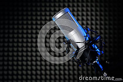 Microphone in the studio with noise cancelling panel. Professional sound recording equipment Stock Photo