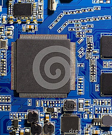Microprocessor on blue circuit board. Close-up of a computer microchip Stock Photo