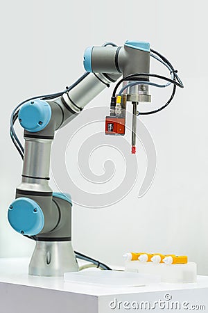 Microscan demonstrates industrial robotic machine using the Vision HAWK smart camera. Stock Photo