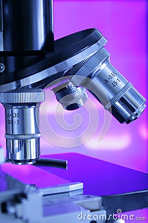 Microscope against violet electrophoresis results Stock Photo