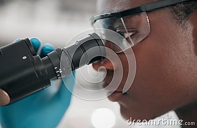 Microscope, black man and healthcare with research, medical and dna test with biotechnology. African person, science and Stock Photo