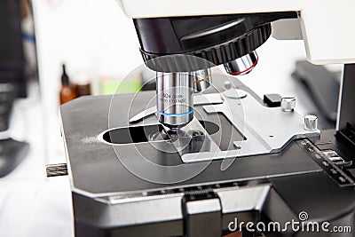 Microscope slide with pap smear sample on the microscope for scientist diagnosis at cytology or pathology department. Cervical Stock Photo