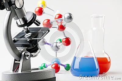 Microscope, Vials and Atoms Stock Photo